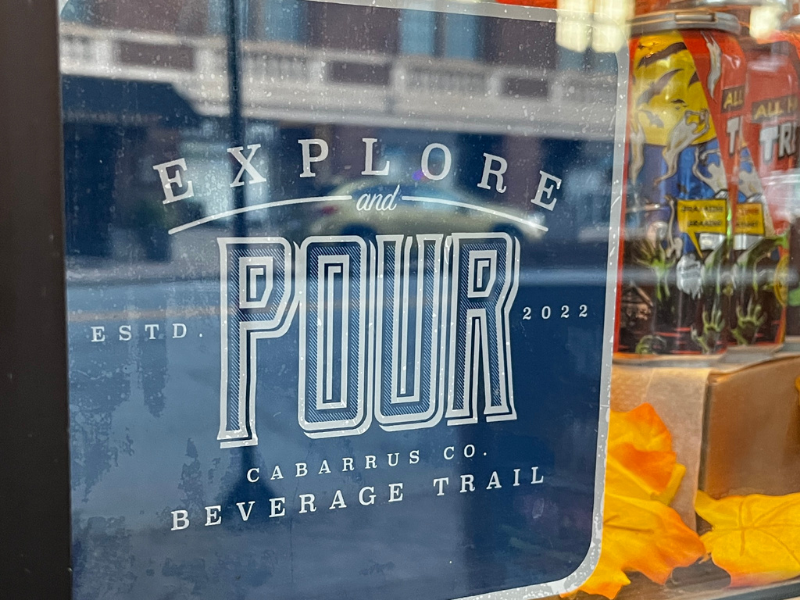 Explore and Pour beverage trail window sign