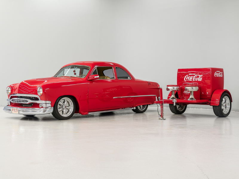 Red classic car with Coca-Cola trailer